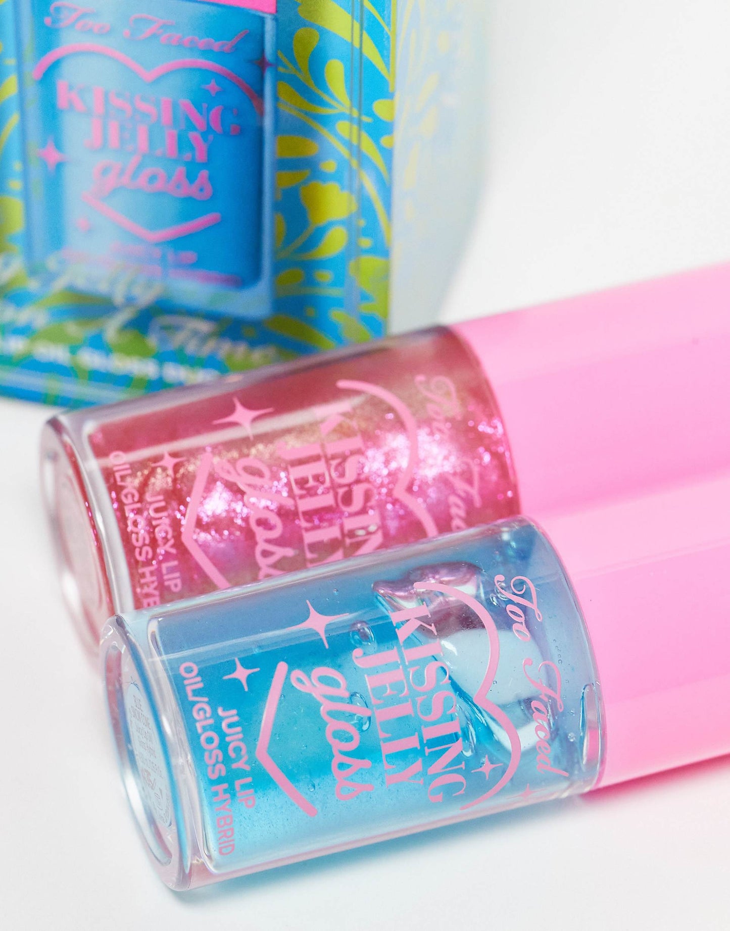 Too Faced Kissing Jelly Twice Upon A Time Limited Edition Lip Oil Gloss Duo includes two full-size hydrating lip oil-gloss hybrids in shades Bubblegum and limited-edition Blue Snow Cone.