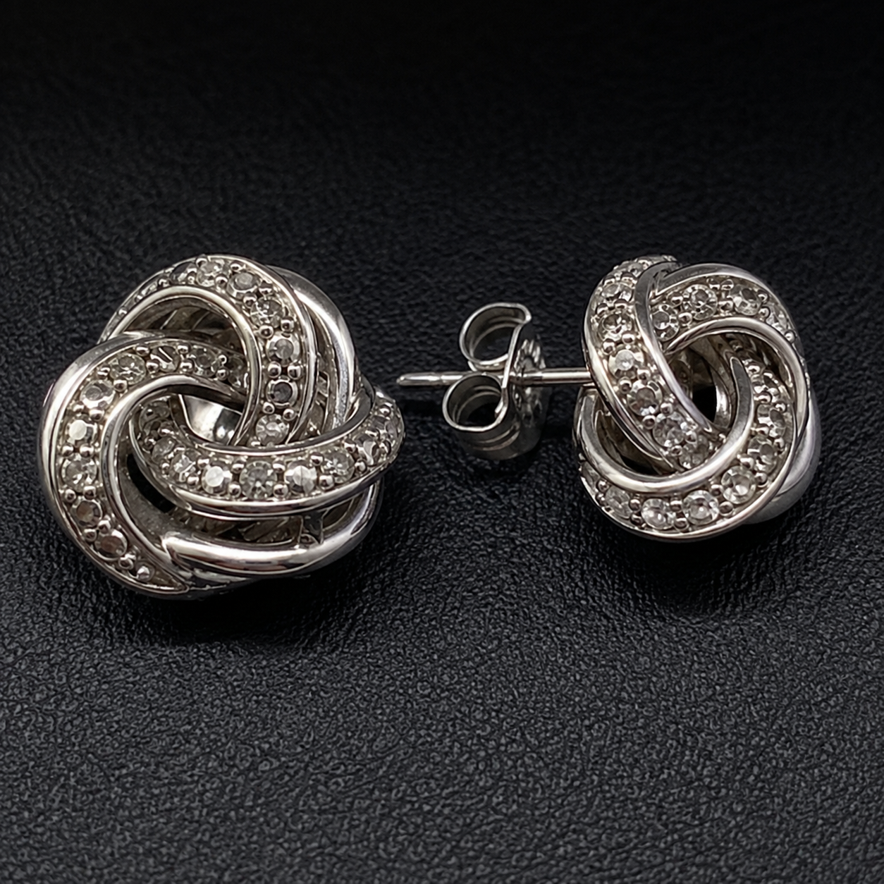 R.H. Macy & Co. sterling silver and diamond love knot stud earrings