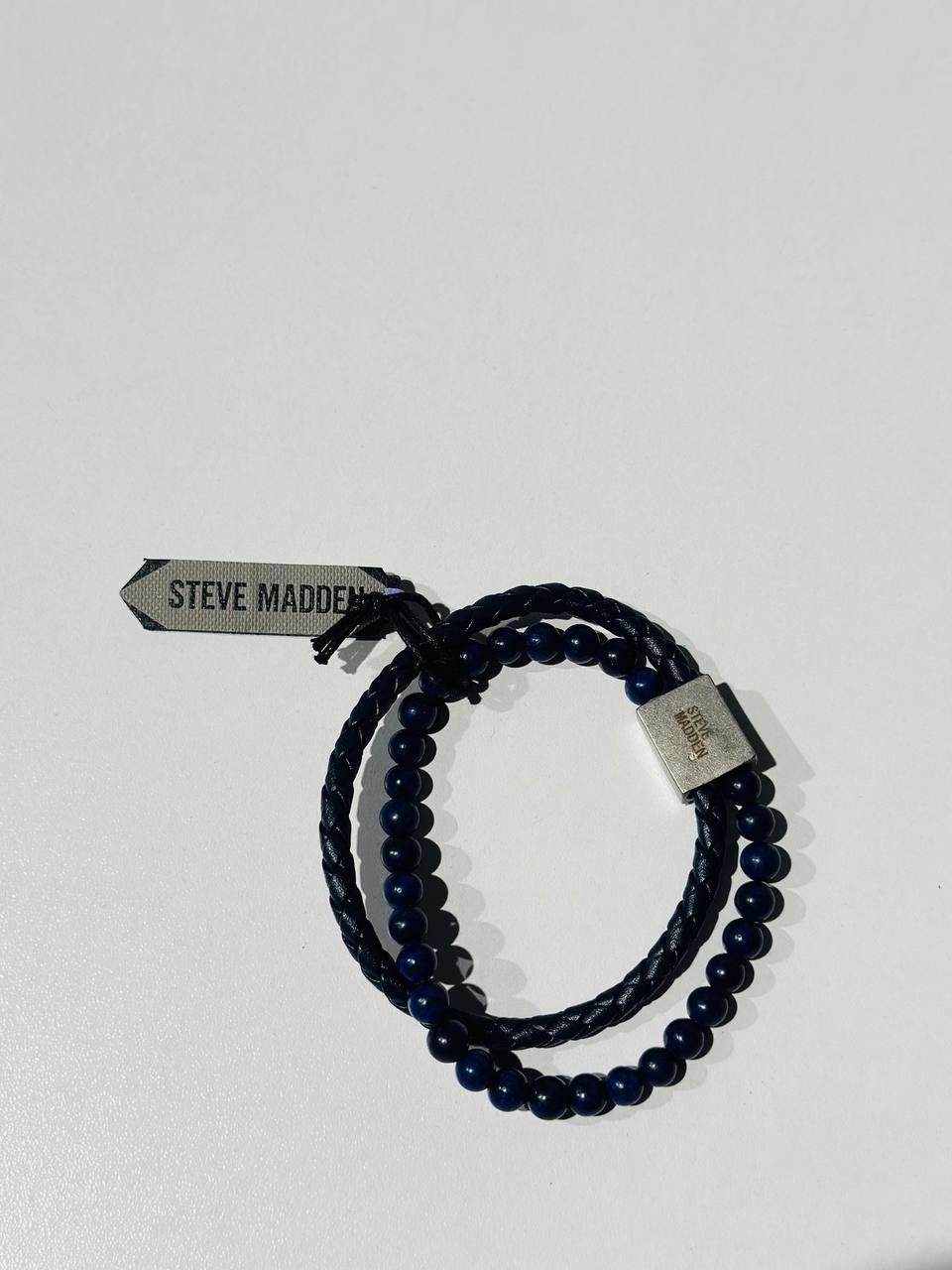 a Steve Madden men's bracelet featuring blue beads and a braided leather strap