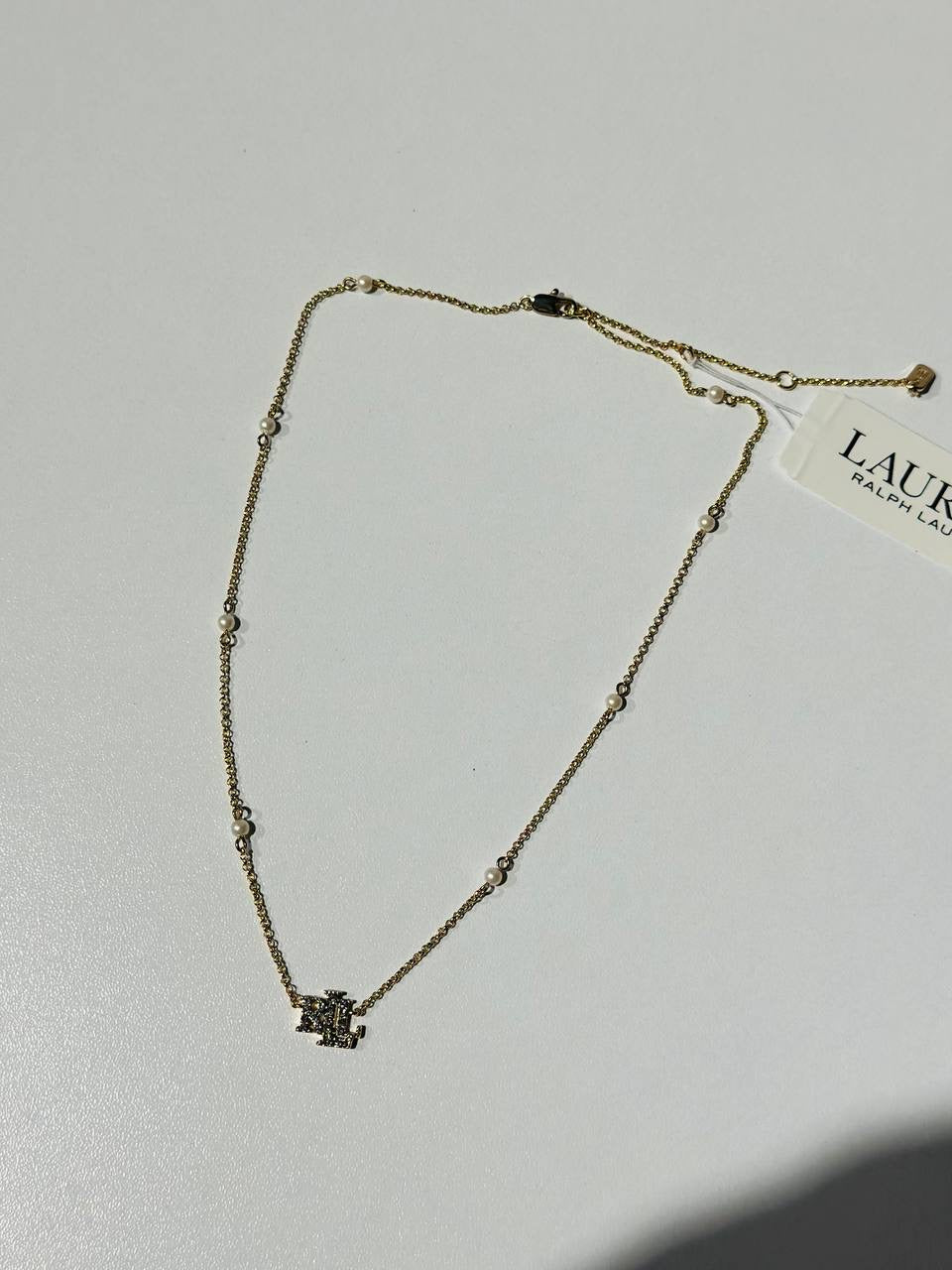 Ralph Lauren gold-toned necklace with pearls and a crystal-embellished "LRL" logo pendant