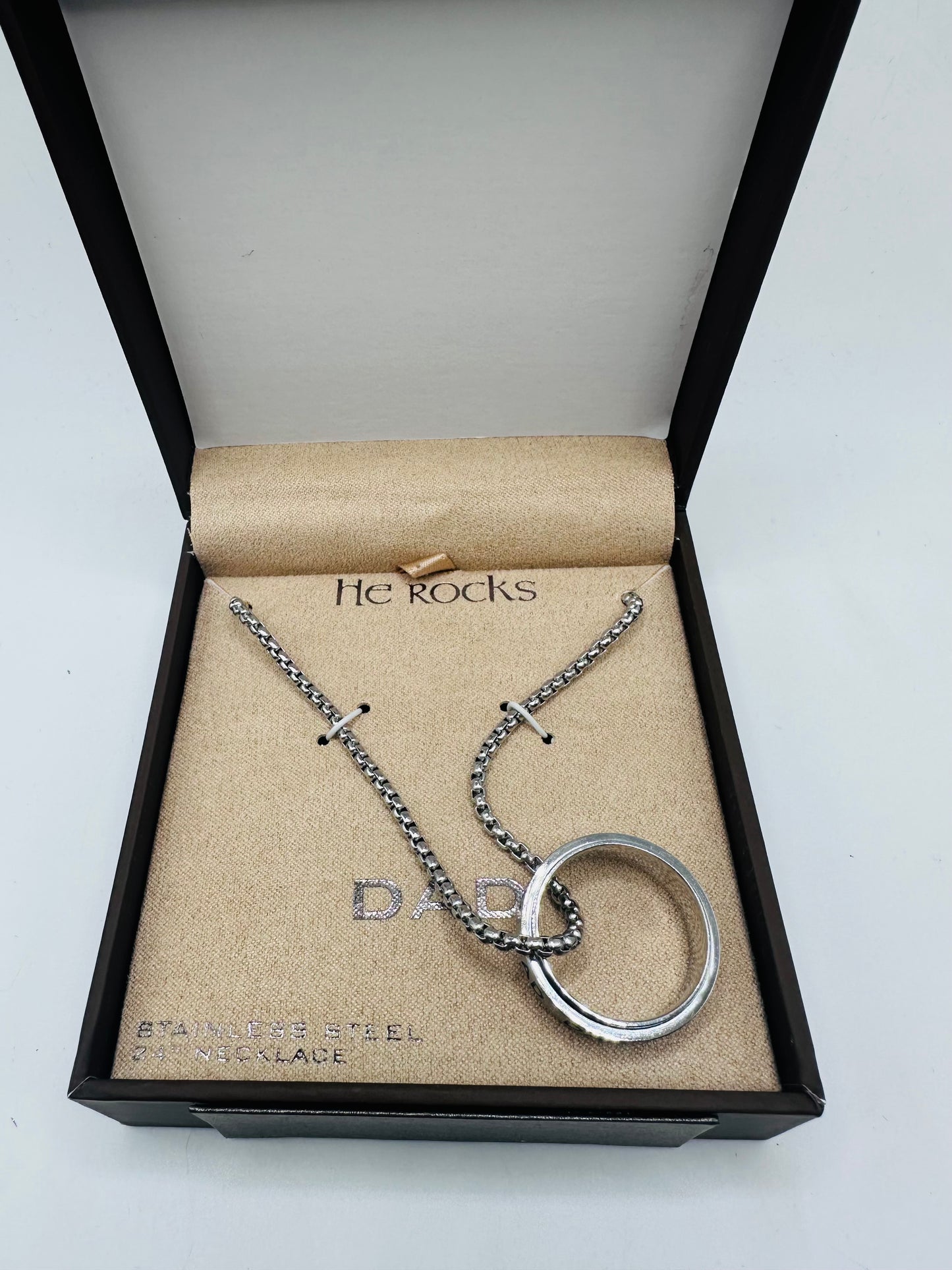 He rock ''Dad" stainless steel ring and necklace set.