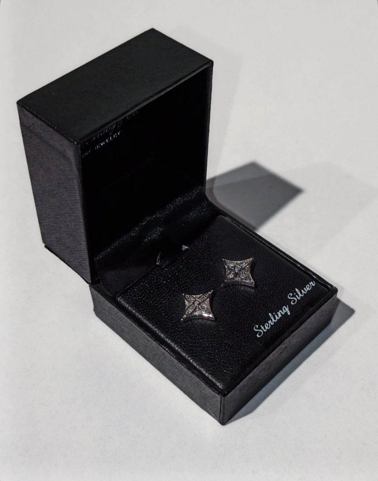 R.H. Macy & Co. sterling silver diamond Star Stud Earrings