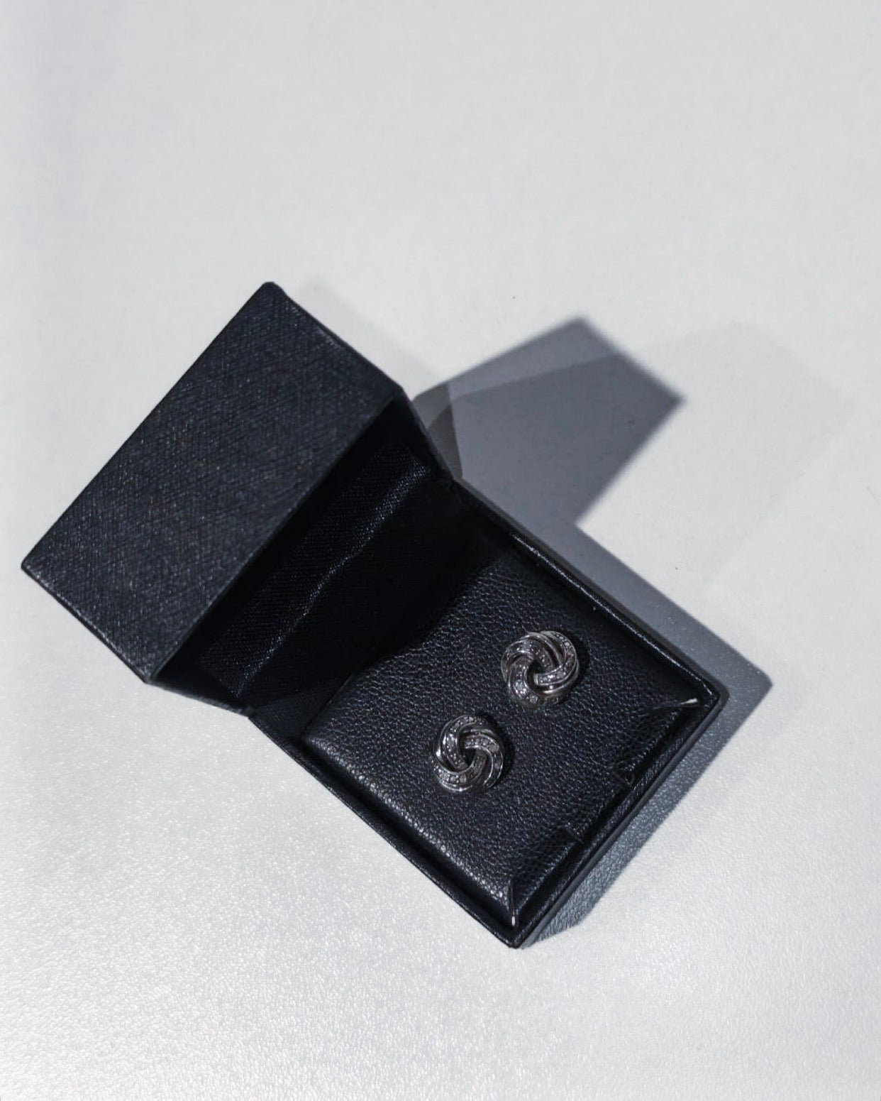 R.H. Macy & Co. sterling silver and diamond love knot stud earrings