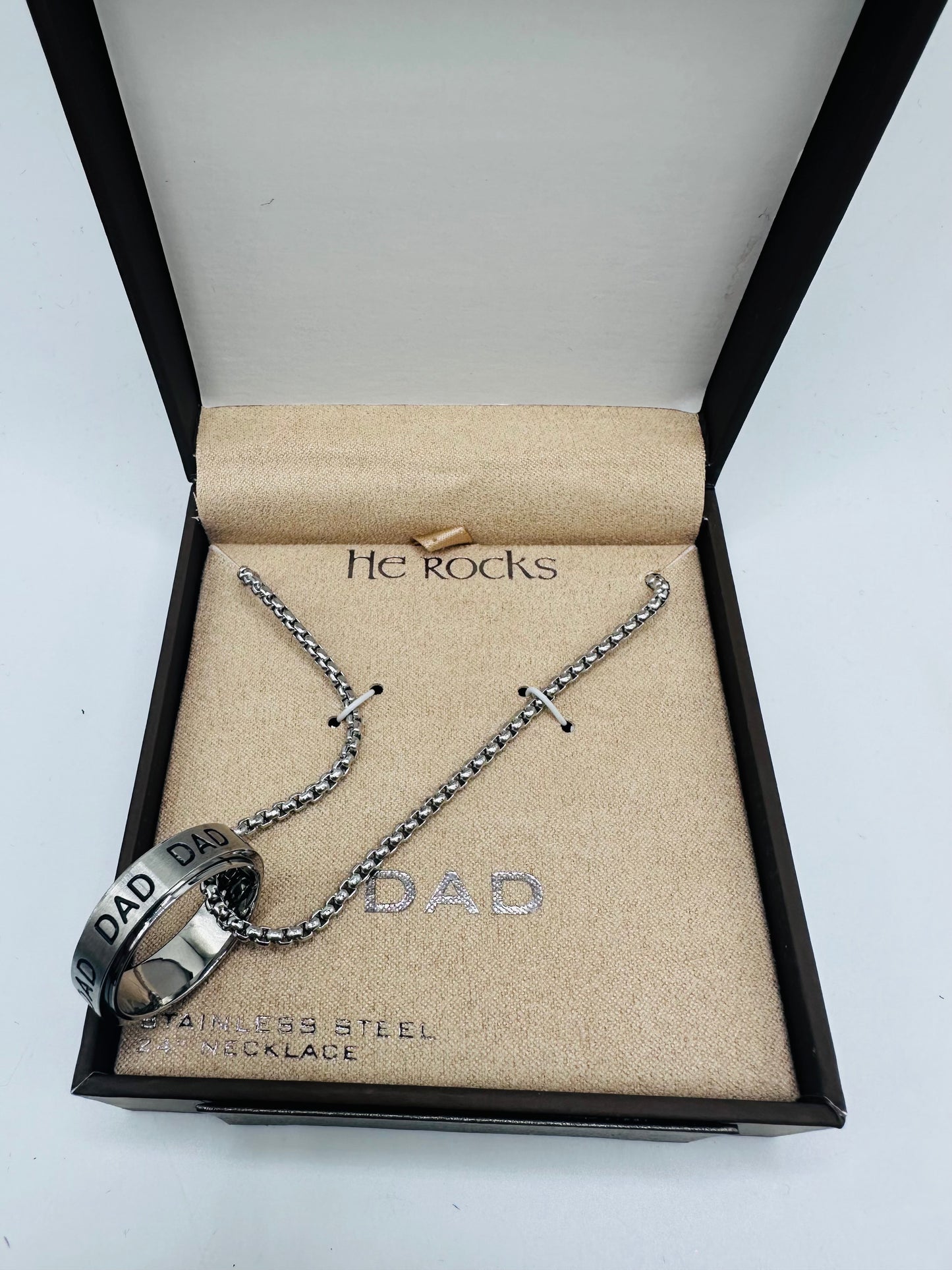 He rock ''Dad" stainless steel ring and necklace set.