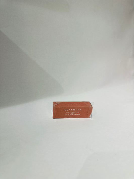 Cover FX Custom Enhancer Drops, a  liquid highlighter designed to provide a customizable glow shade rose gold