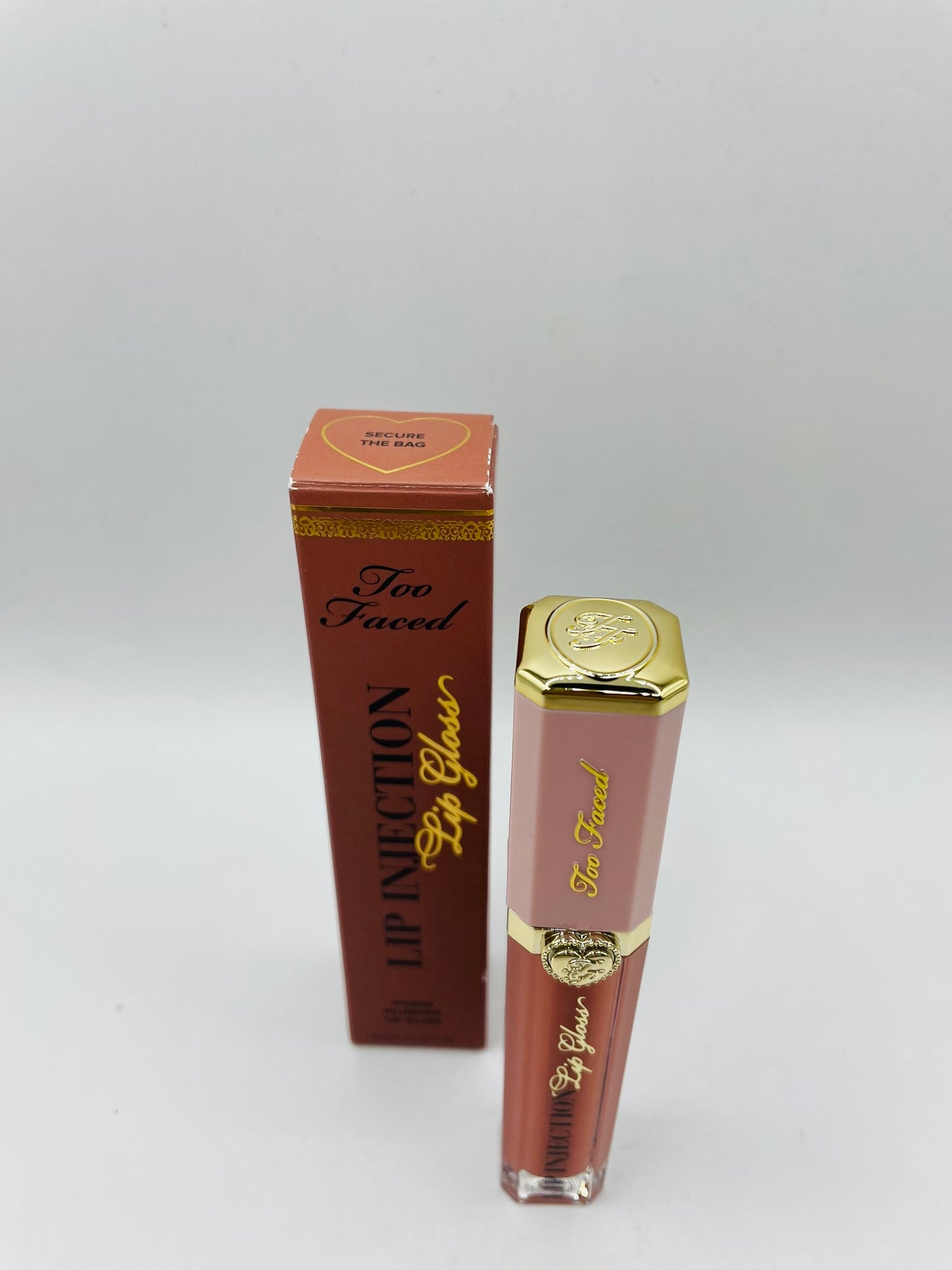Too faced lip injection secure the bag