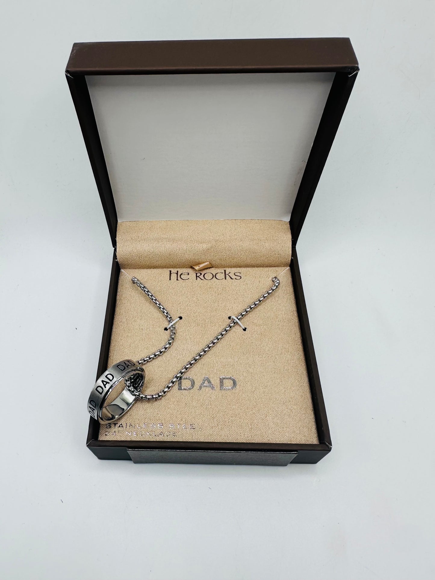 He rock ''Dad" stainless steel ring and necklace set.